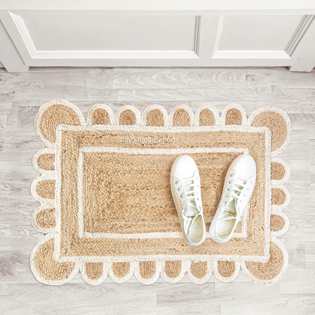 Hand-woven rectangle jute rug with braided border.